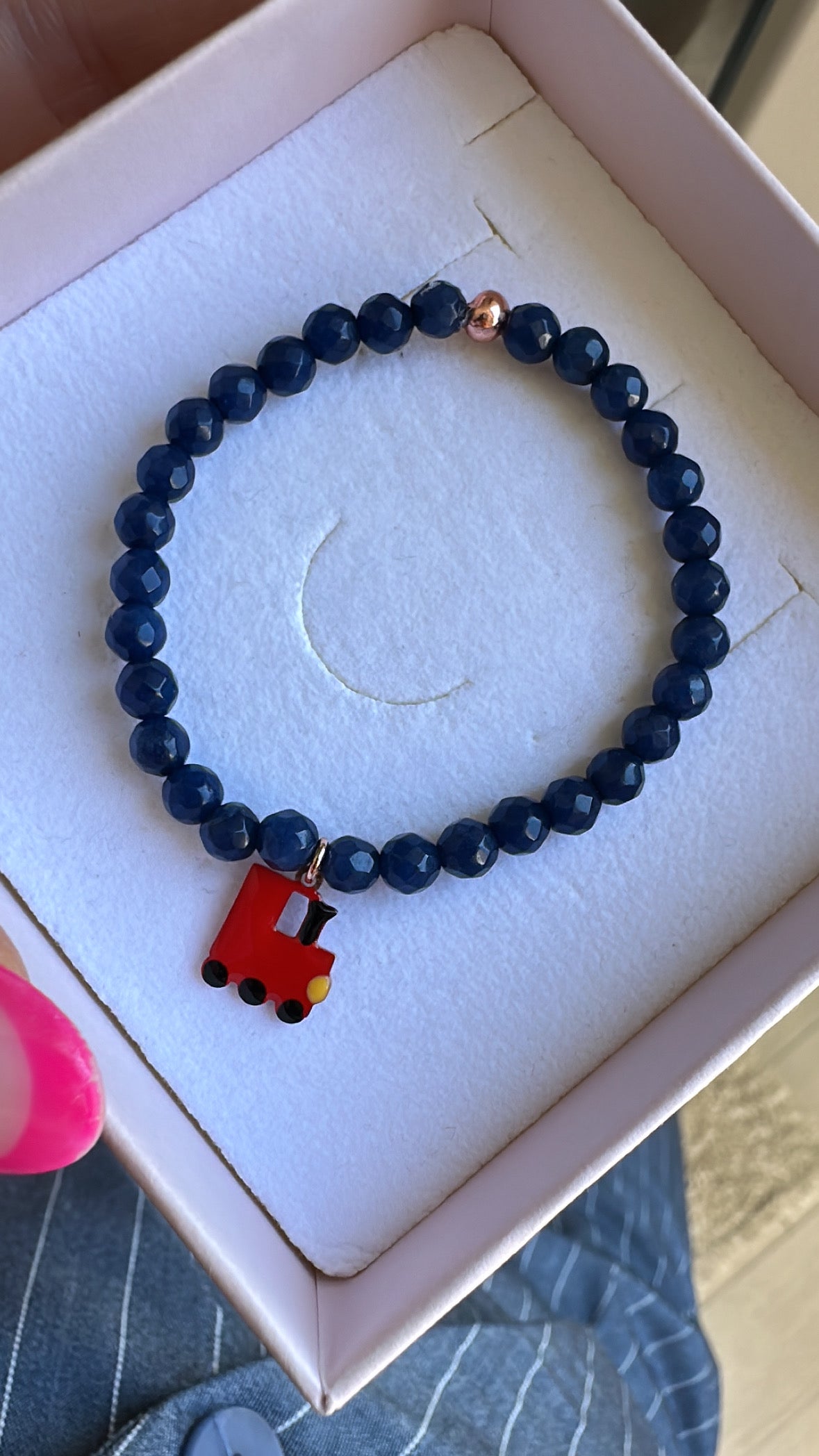 BRACCIALE ELASTICO BIMBO CON RADICE DI ZAFFIRO E TRENINO IN ARGENTO 925 SMALTATO