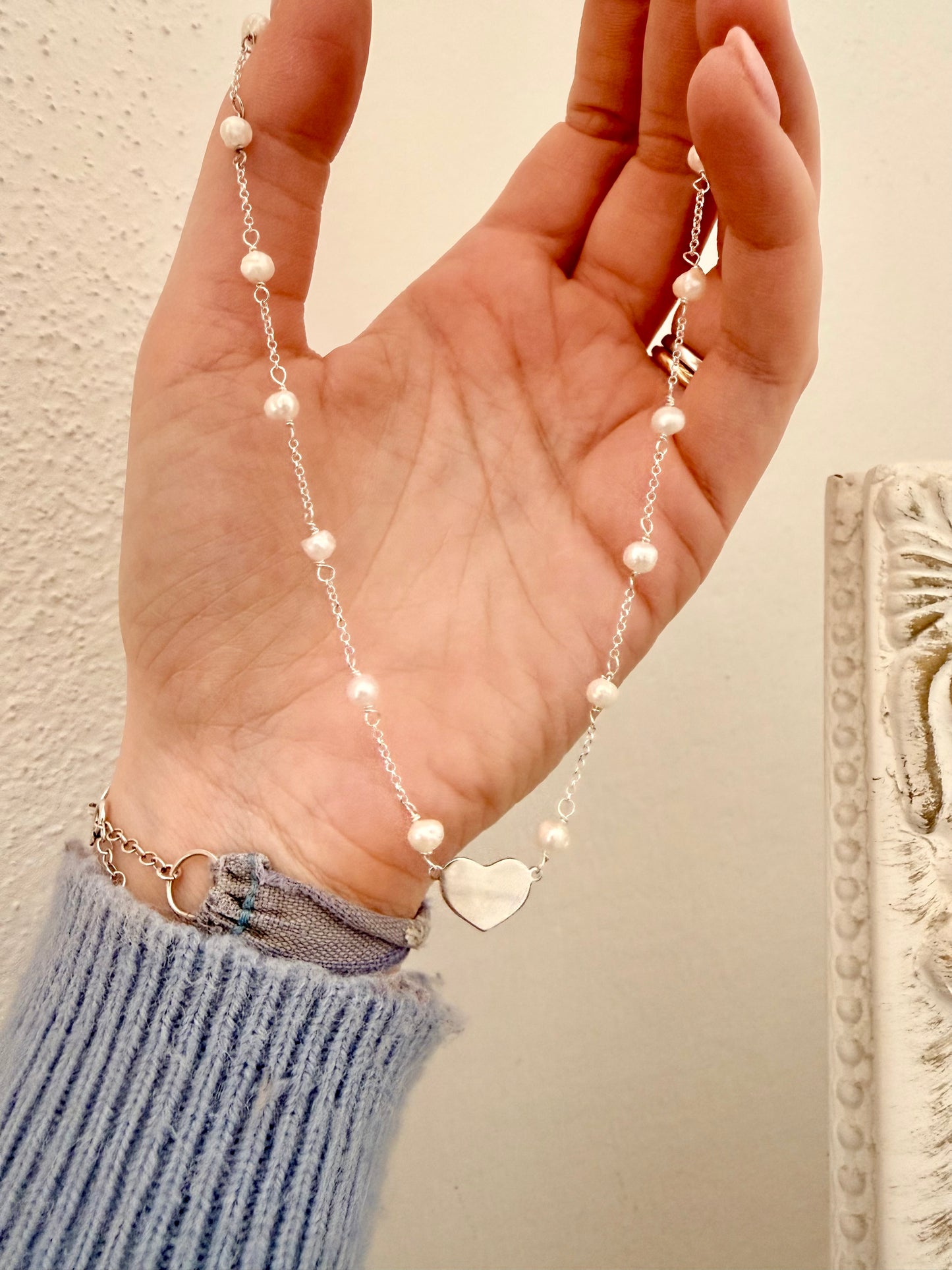COLLANA RADO PERLE BIANCHE CON CUORE IN LINEA