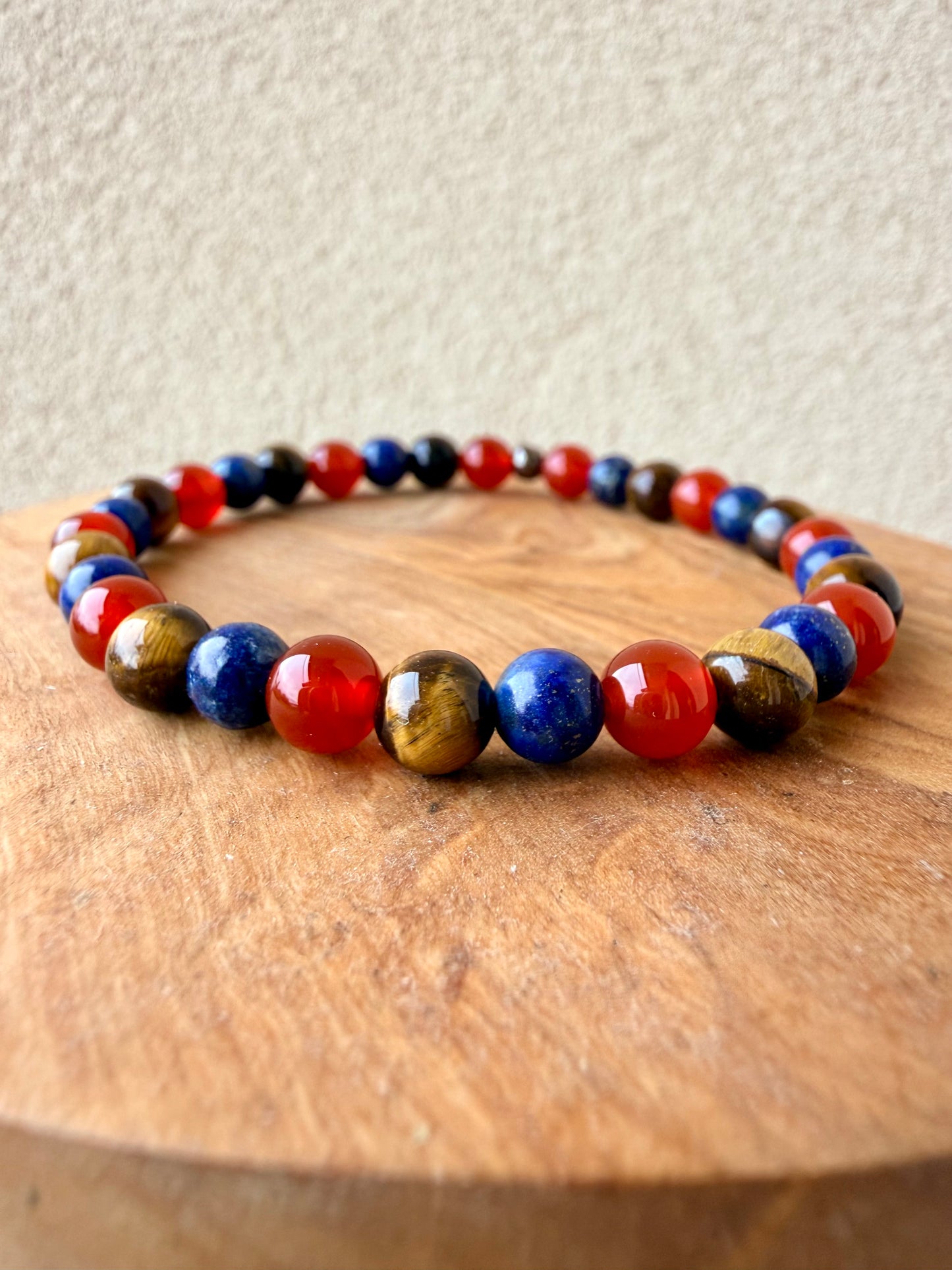 BRACCIALE ELASTICO CON GIADA ROSSA, OCCHIO DI TIGRE E LAPISLAZZULI