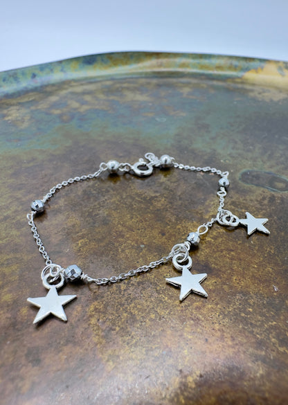 BRACCIALE CATENA ACCIAIO, EMATITE E STELLINE PENDENTI