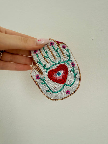 PORTAFOGLIO PICCOLO MANO CON OCCHIO DELLA PROVVIDENZA ORO-BIANCO-FUCSIA-ROSSO-VERDE