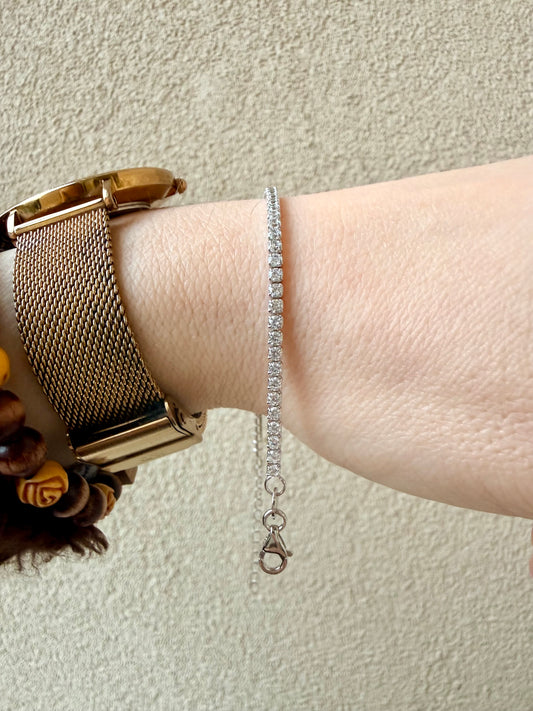 BRACCIALE TENNIS CON ZIRCONI BIANCHI 2 mm IN ARGENTO RODIATO CON CHIUSURA A MOSCHETTONE