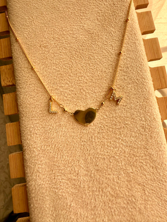 COLLANA CON INIZIALI ZIRCONATE E CUORE PIENO CENTRALE