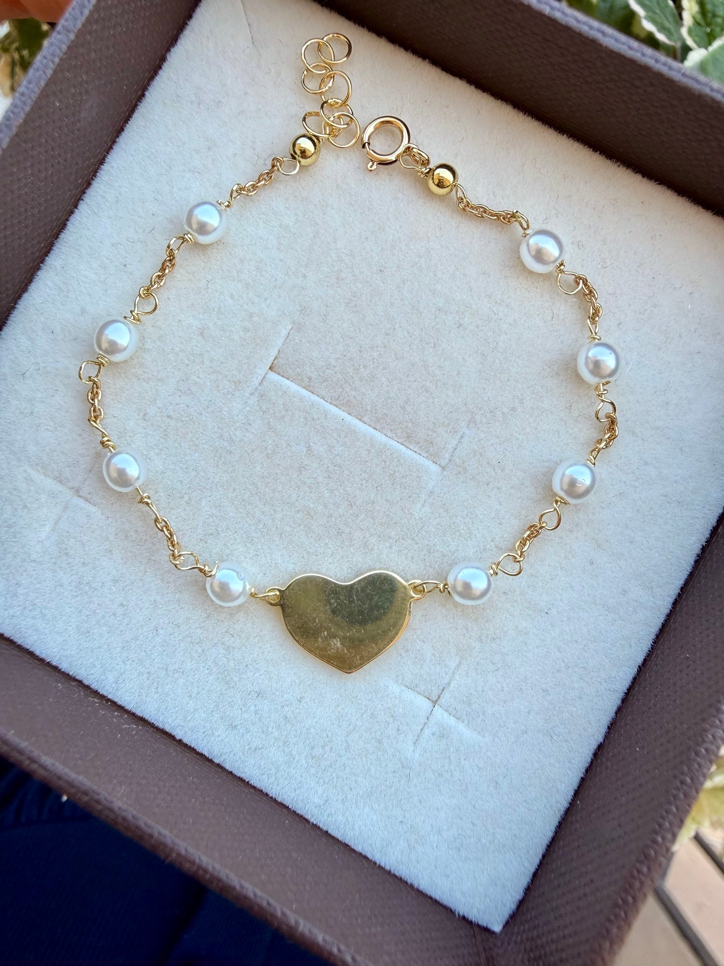 BRACCIALE RADO PERLE CON CUORE IN LINEA