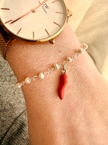 BRACCIALE PORTA FORTUNA RADO PERLE E CORNETTO ROSSO PENDENTE